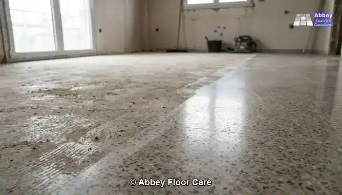 Understanding the Impact of Grinding and Polishing Terrazzo in Edinburgh Homes: Aged terrazzo floor in a period Edinburgh room with a muted, timeworn surface.